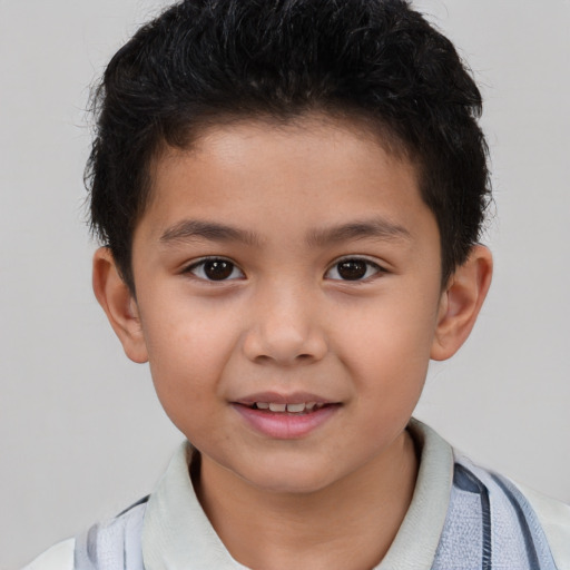 Joyful white child male with short  brown hair and brown eyes