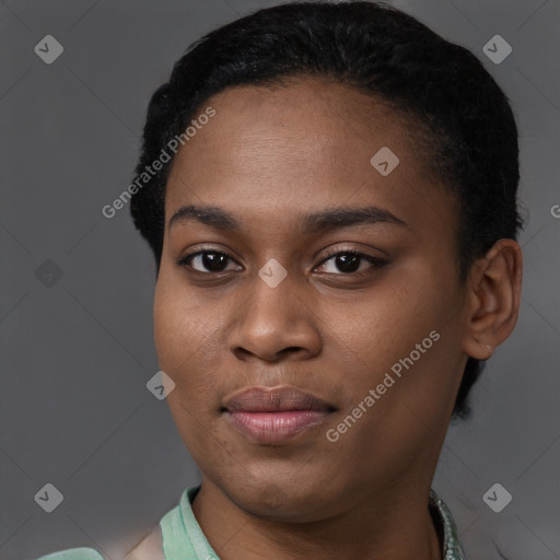 Joyful black young-adult female with short  black hair and brown eyes