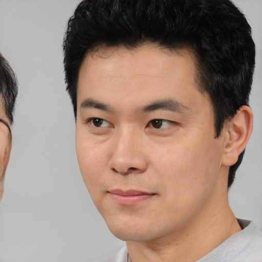 Neutral asian young-adult male with short  black hair and brown eyes