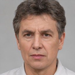 Joyful white middle-aged male with short  brown hair and brown eyes