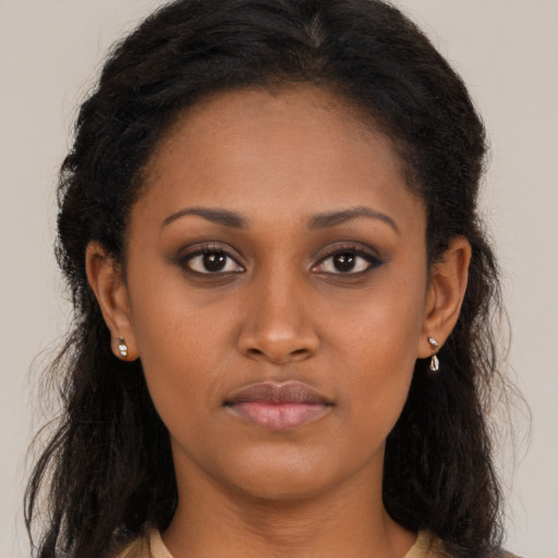 Neutral black young-adult female with long  brown hair and brown eyes