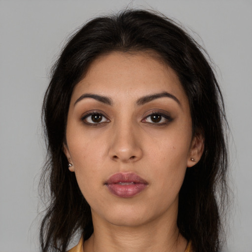 Neutral latino young-adult female with long  brown hair and brown eyes