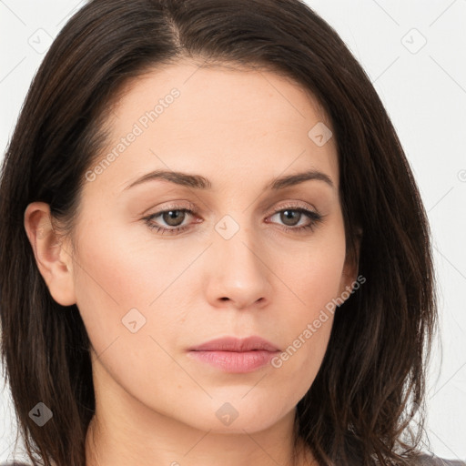 Neutral white young-adult female with long  brown hair and brown eyes