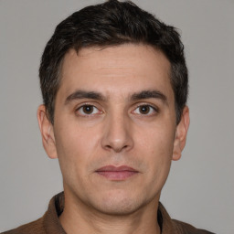 Neutral white young-adult male with short  brown hair and brown eyes