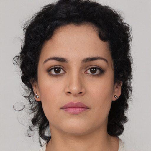 Neutral latino young-adult female with medium  brown hair and brown eyes