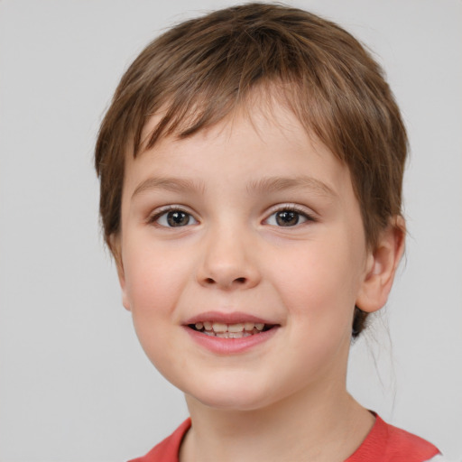 Joyful white child female with short  brown hair and brown eyes