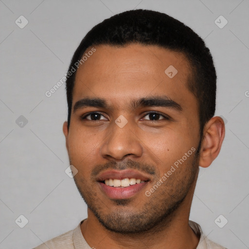 Joyful latino young-adult male with short  black hair and brown eyes