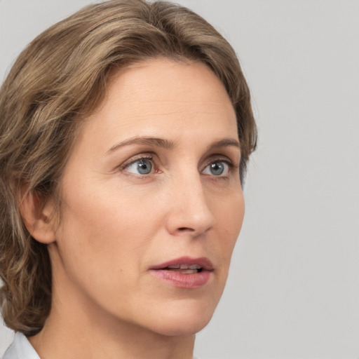 Neutral white young-adult female with medium  brown hair and grey eyes