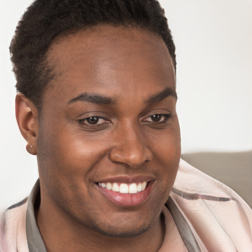 Joyful black young-adult female with short  brown hair and brown eyes