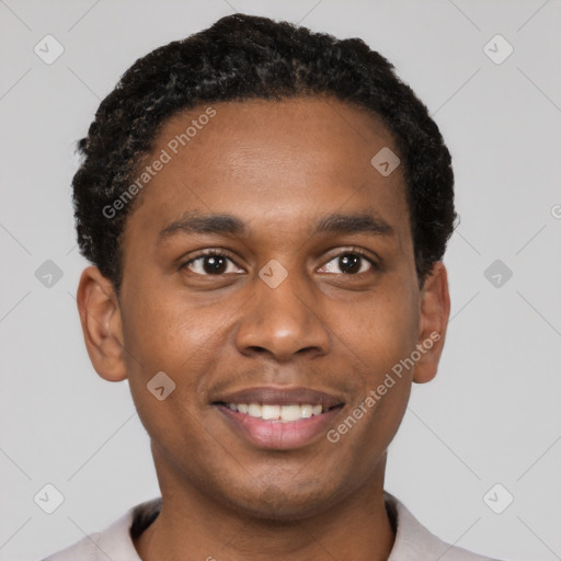 Joyful black young-adult male with short  black hair and brown eyes