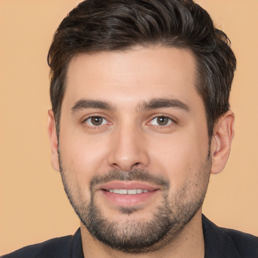 Joyful white young-adult male with short  brown hair and brown eyes