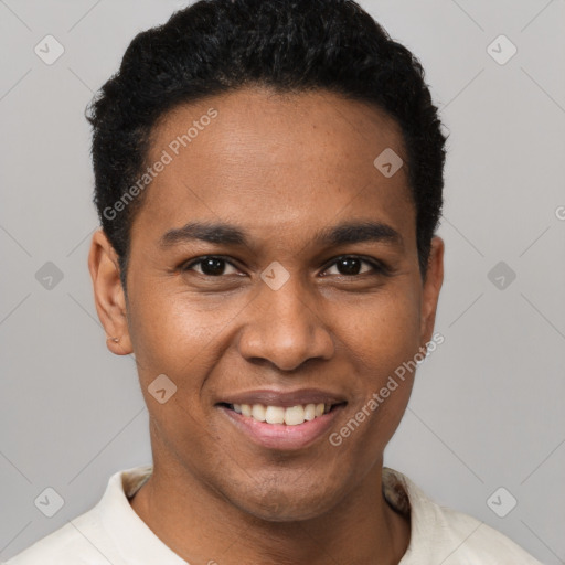 Joyful black young-adult male with short  black hair and brown eyes