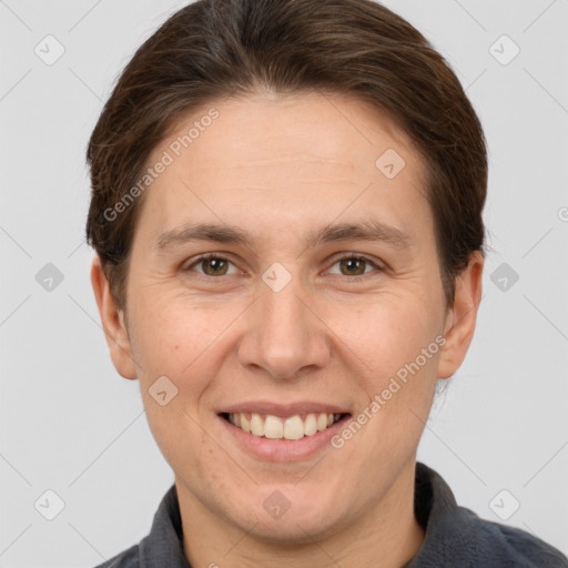 Joyful white adult female with short  brown hair and grey eyes