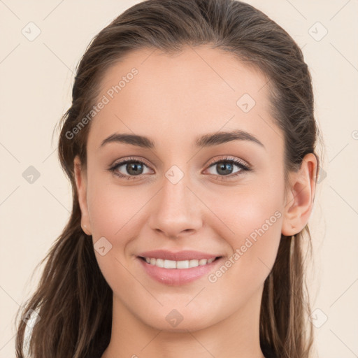 Joyful white young-adult female with long  brown hair and grey eyes