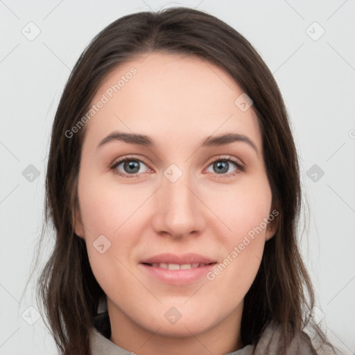 Joyful white young-adult female with long  brown hair and grey eyes