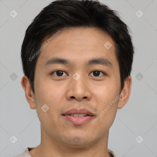 Joyful asian young-adult male with short  brown hair and brown eyes