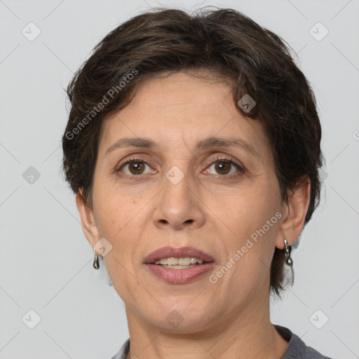 Joyful white adult female with short  brown hair and brown eyes