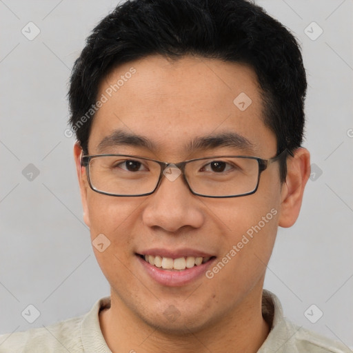 Joyful asian young-adult male with short  brown hair and brown eyes