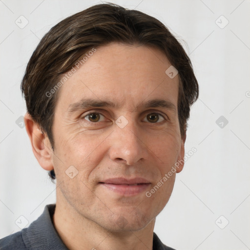 Joyful white adult male with short  brown hair and brown eyes