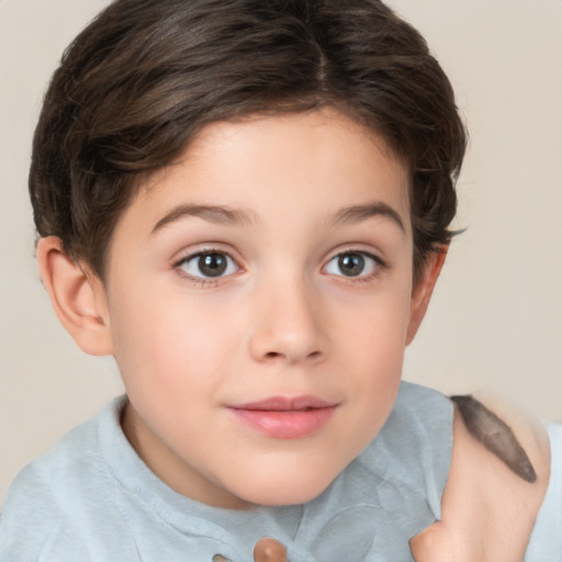 Joyful white child female with short  brown hair and brown eyes