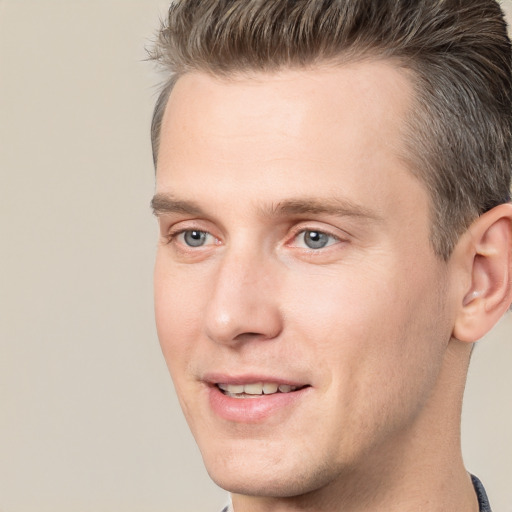 Joyful white young-adult male with short  brown hair and brown eyes