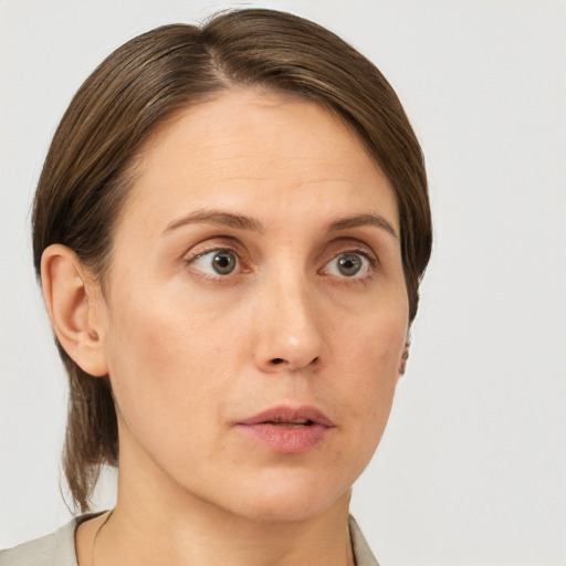 Neutral white young-adult female with short  brown hair and grey eyes