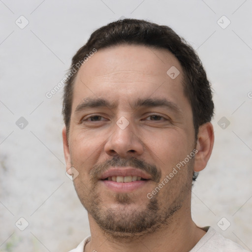 Joyful white adult male with short  brown hair and brown eyes