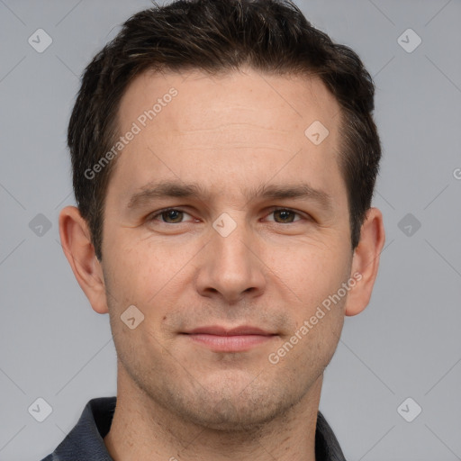 Joyful white adult male with short  brown hair and brown eyes