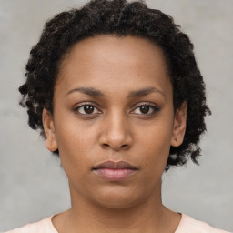 Neutral black young-adult female with short  brown hair and brown eyes