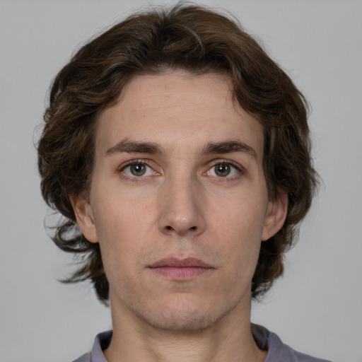 Neutral white young-adult male with medium  brown hair and brown eyes