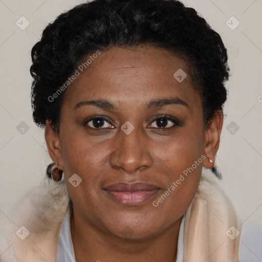 Joyful black adult female with short  brown hair and brown eyes