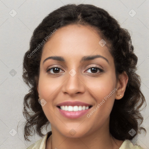 Joyful latino young-adult female with long  brown hair and brown eyes