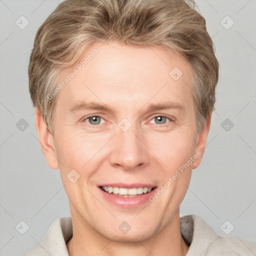 Joyful white adult male with short  brown hair and grey eyes