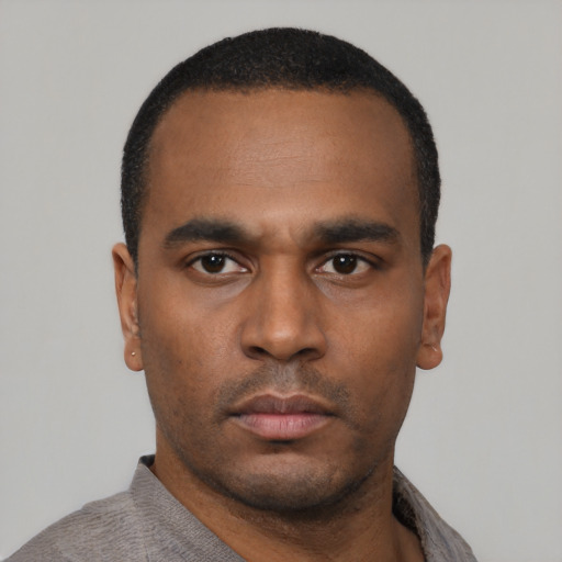 Neutral black young-adult male with short  black hair and brown eyes