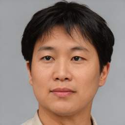 Neutral asian young-adult male with short  brown hair and brown eyes