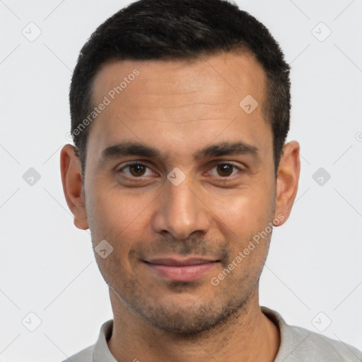 Joyful white young-adult male with short  black hair and brown eyes