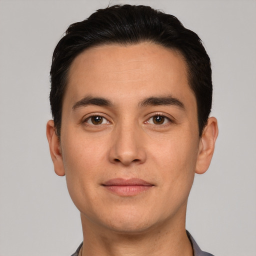 Joyful white young-adult male with short  black hair and brown eyes