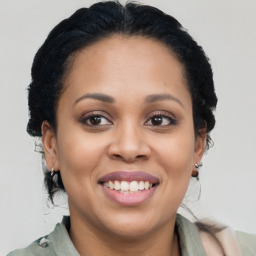 Joyful latino young-adult female with medium  brown hair and brown eyes