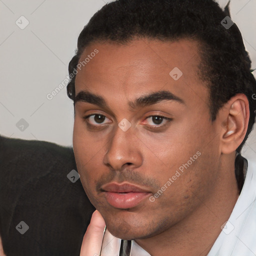Neutral white young-adult male with short  black hair and brown eyes