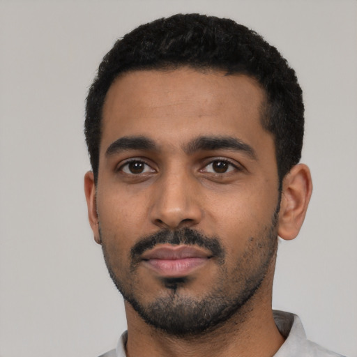 Neutral black young-adult male with short  black hair and brown eyes