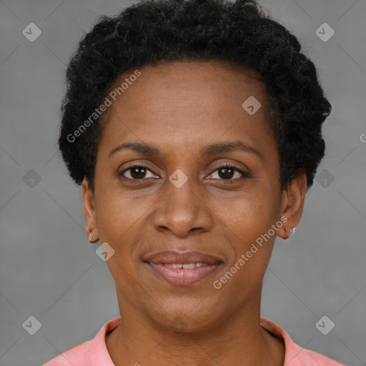 Joyful black adult female with short  brown hair and brown eyes