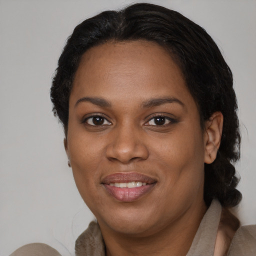 Joyful black young-adult female with medium  brown hair and brown eyes