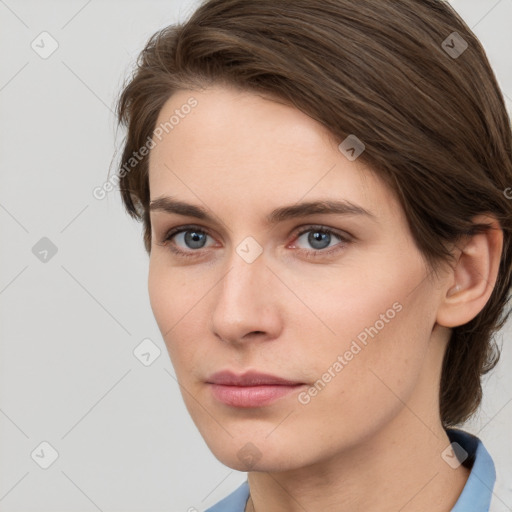 Neutral white young-adult female with short  brown hair and grey eyes