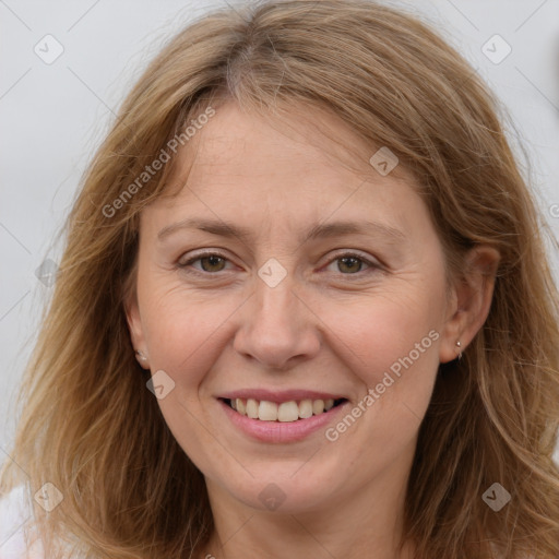 Joyful white adult female with long  brown hair and brown eyes