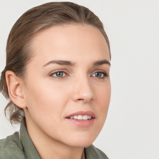 Joyful white young-adult female with long  brown hair and grey eyes