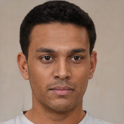 Neutral latino young-adult male with short  black hair and brown eyes