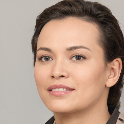 Joyful white young-adult female with medium  brown hair and brown eyes