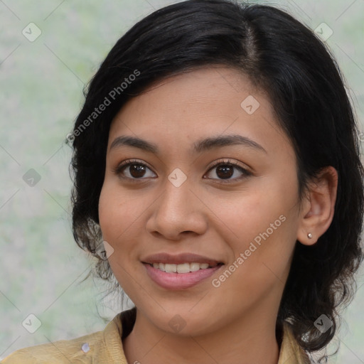 Joyful latino young-adult female with medium  brown hair and brown eyes