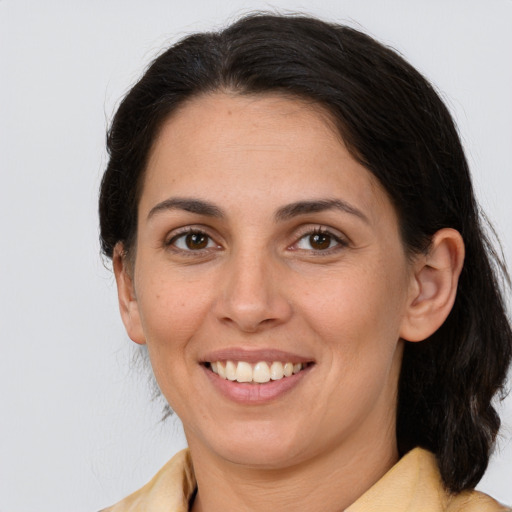 Joyful white young-adult female with medium  brown hair and brown eyes