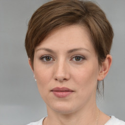 Neutral white young-adult female with short  brown hair and grey eyes